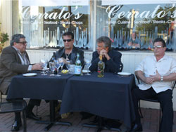 Men at table outside Cerratos restaurant