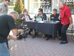 Men at table outside Cerratos restaurant