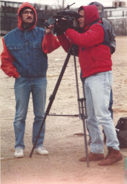 Three people with video camera